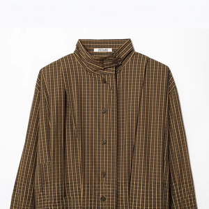 Classic brown and yellow plaid shirt with stand collar and buttoned placket in a clean shot
