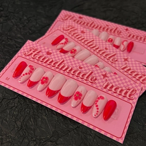 Handmade red and pink floral press-on nails in long almond shape with French design