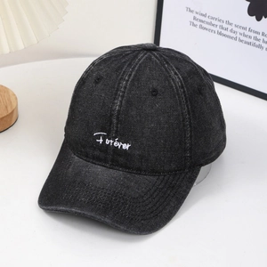 Retro washed grey denim baseball cap with Forever embroidery on a minimalist background