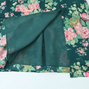 Deep green floral midi dress with pink roses and elegant side slit detail