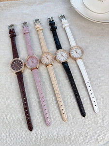 Close-up of luxury women's crystal watches with leather straps in five colors