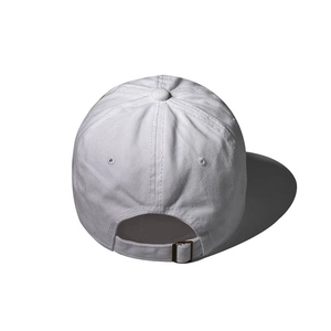 Rear view of white cotton baseball cap showing adjustable bronze metal buckle