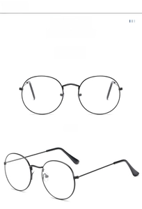 Detailed view of retro round metal eyeglass frames in black finish with nose pads