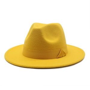 Detailed close-up showing the wool felt texture and ribbon trim on this yellow fedora hat