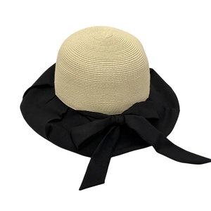 Women straw sun hat with wide black brim and large bow accent for UV protection