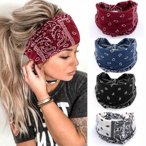 Detailed view of elastic paisley bandanas in red, blue, black, and white colors