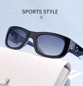 Detail of black sports sunglasses with blue gradient lenses and white leather case