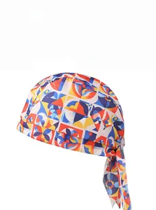 Detail of breathable pirate headscarf featuring vibrant red, blue and yellow geometric patterns