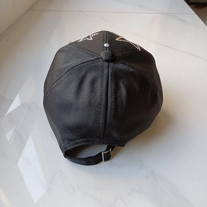Black baseball cap with rhinestone star pattern and adjustable silver buckle