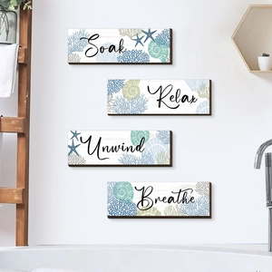 Set of 4 ocean-themed wooden wall plaques featuring Relax Soak Unwind and Breathe texts