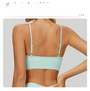 Detail view of the open square back cutout on a mint green seamless yoga bra