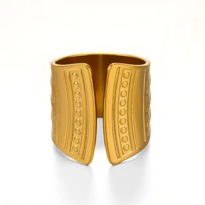 Irregular wide open ring in gold finish with embossed geometric texture and wave design