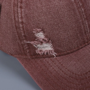 Distressed burgundy washed denim baseball cap featuring vintage ripped hole details