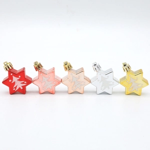 Five colored metallic star-shaped Christmas ornaments with glitter tree patterns