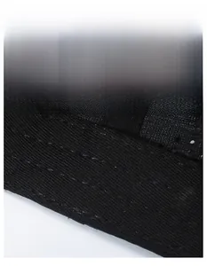 Close-up of the widened sweatband with breathable mesh on the black sport cap