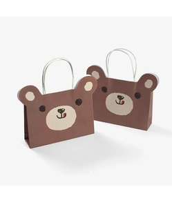 Detail of cute brown bear cartoon paper gift bags with sturdy white cord handles