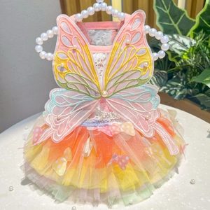 Detail of pet princess dress with rainbow mesh skirt and embroidered butterfly wings