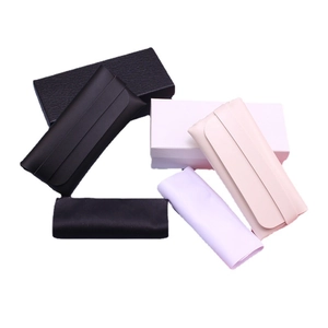 Set of woven leather glasses cases with matching cardboard packaging boxes and soft pouches