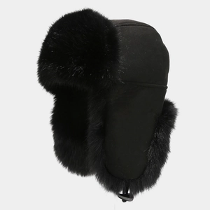 Side view of black winter trapper hat featuring thick faux fur lining and suede finish