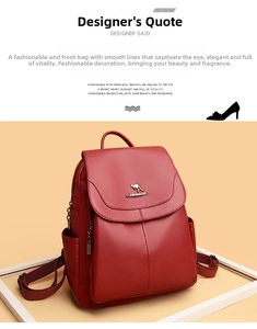 Close-up of red leather backpack featuring pebble grain texture and metal kangaroo logo