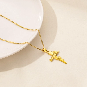Detailed close-up of 18K gold-plated necklace with a rose and cross pendant design