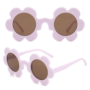 Detailed macro view of purple flower shaped frame and brown lenses for kids sunglasses