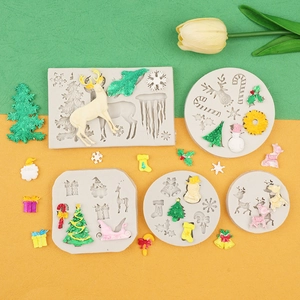 Detail view of silicone Christmas mold set featuring reindeer, snowflakes, and trees