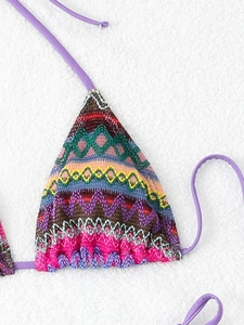 Detailed close-up of knit ethnic pattern on a triangle bikini top with purple straps