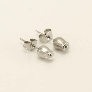 Macro shot of silver tulip bud earrings in polished stainless steel with stud backs