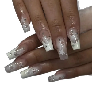 Classic white gradient press-on nails with silver rhinestones and star art designs