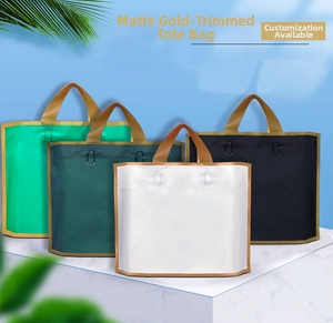 Frosted gift bags with gold edges and thick brown handles in various colors on sky background