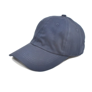 Detailed close-up of a navy blue cotton baseball cap with reinforced stitched brim