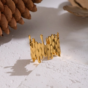 Minimalist gold irregular textured wide ring with a unique fluid molten metal design