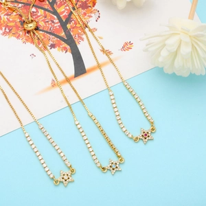 Detailed shot of three gold star bolo bracelets with colorful cubic zirconia center stones