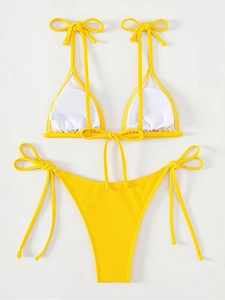 Close-up of ribbed texture and tie-side details on a bright yellow bikini set