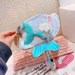 Detail of sequin mermaid fanny pack with tassel and starfish charm for girls