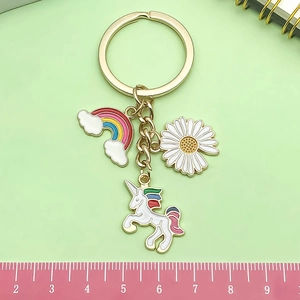 Cartoon rainbow unicorn and daisy keychain pendant with golden alloy finish for bags