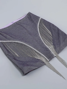 Detail of purple sequin mini skirt with long silver metallic chain fringe on the sides