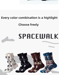 Close-up of crew socks featuring black cats and cartoon dog patterns with ribbed cuffs