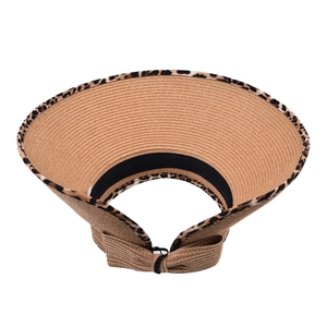 Close-up of woven straw sun visor with leopard print trim and decorative back bow