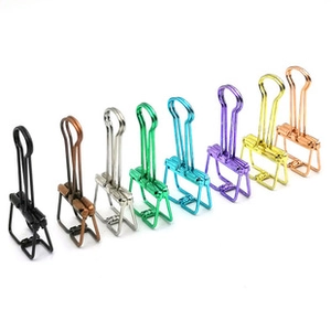 Macro detail of assorted colorful hollow binder clips in various metallic finishes