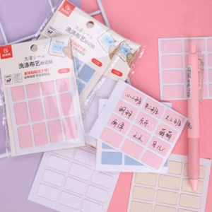 Self-adhesive personalized fabric name labels for kids clothes with pink writing pen