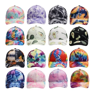 Matrix display of 16 tie-dye and avocado print baseball caps in various colors
