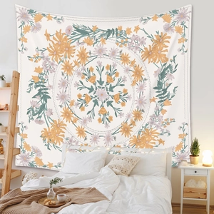Close-up of bohemian floral tapestry with warm orange and violet tones in a bedroom