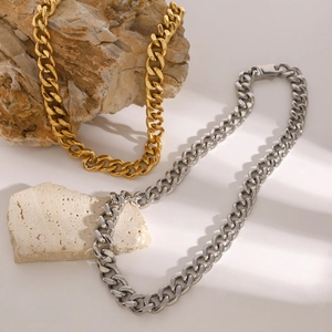 Chunky 11mm stainless steel cuban link chains in gold and silver finish on stones