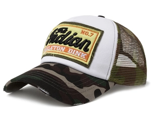 Detail view of American vintage trucker hat with camo brim and yellow skeleton dink patch