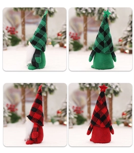 Detail of Christmas gnomes with plaid star hats and long white beards in forest setting