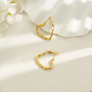 18k gold plated stainless steel heart earrings featuring a unique bamboo knot texture