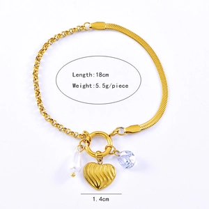 Detail view of 18cm gold stainless steel bracelet with pearl, heart, and zircon charms