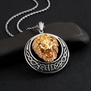 Hiphop iced-out lion head pendant in gold and silver finish on black stone background